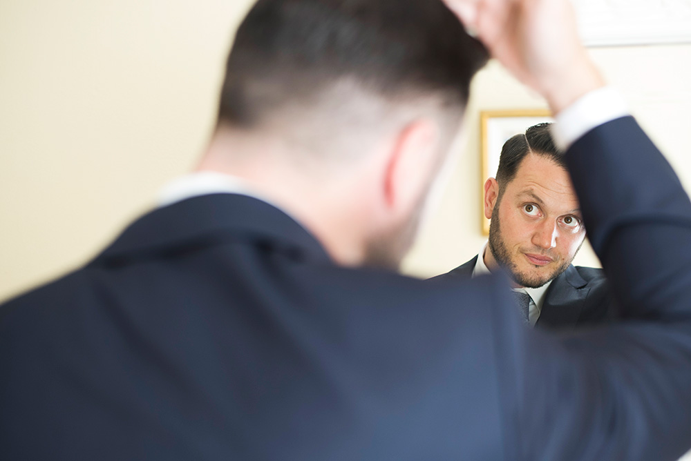 groom in mirror cliff at lyons wedding