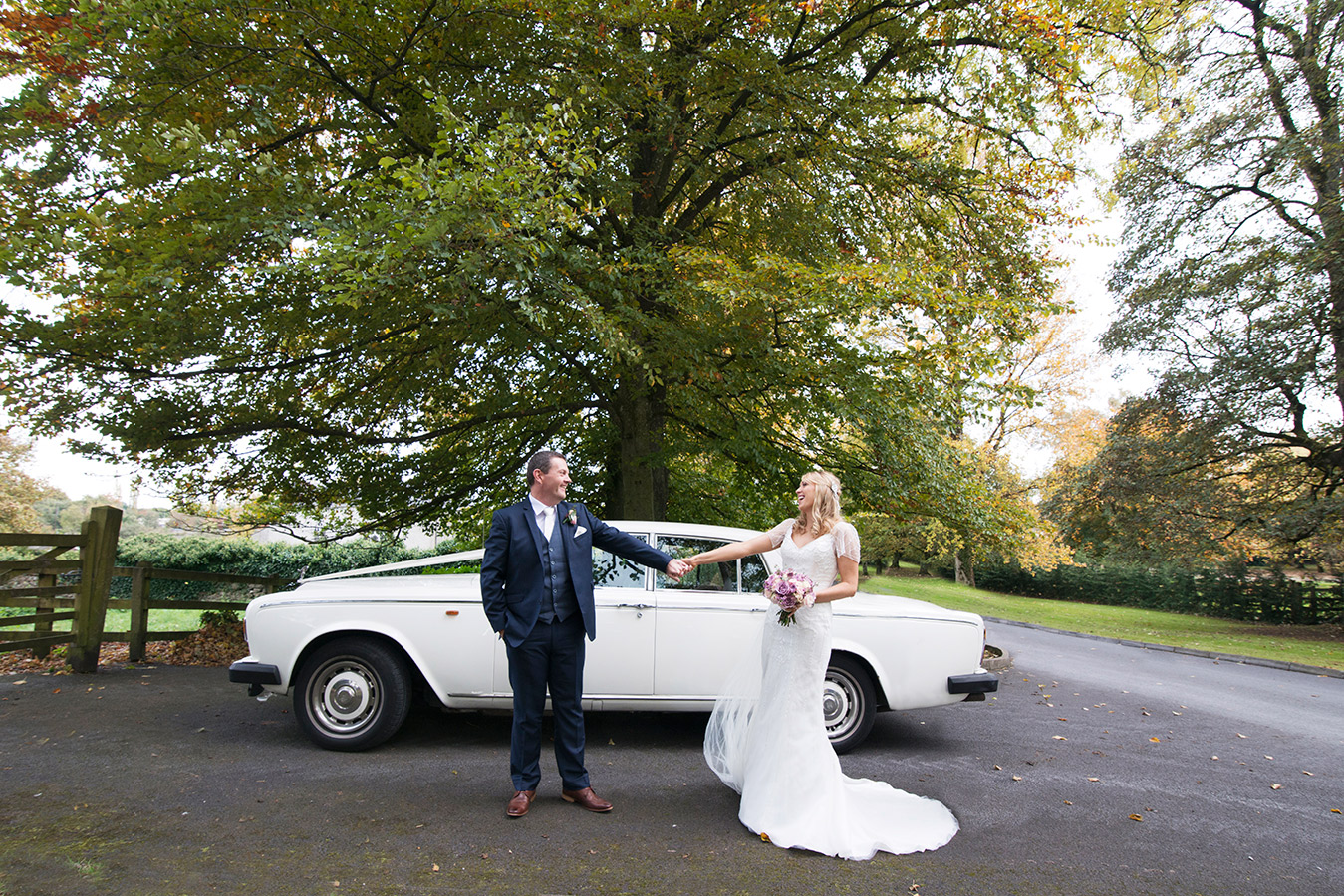 bride and groom with their wedding car at Durrow Castle Wedding