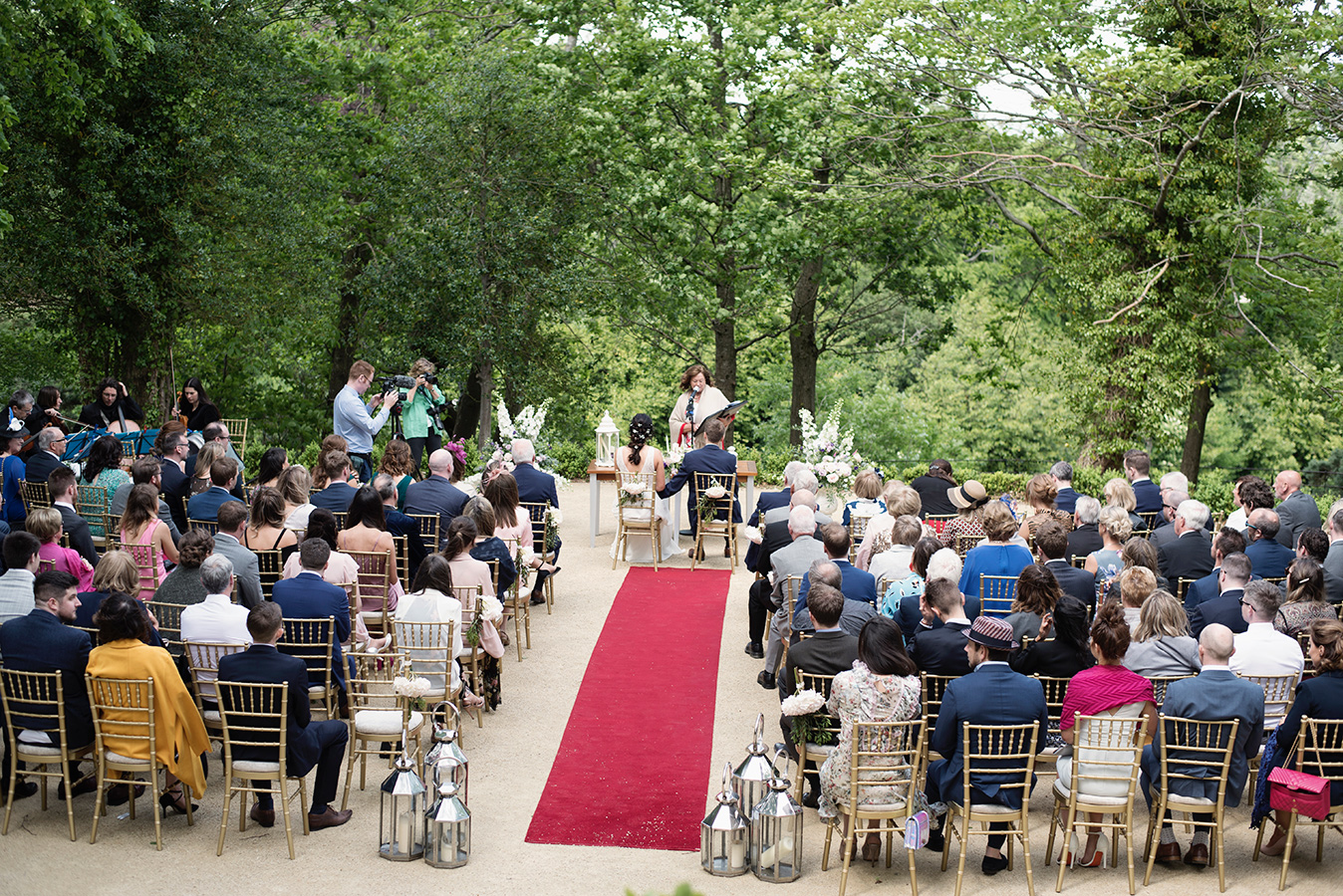 guests at outdoor wedding ceremony at druids glen summer