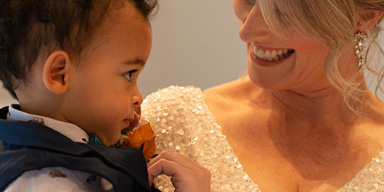 Bride holding her son