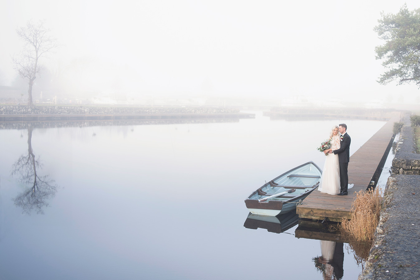 bride and groom at lake in fog at coolbaun quay wedding