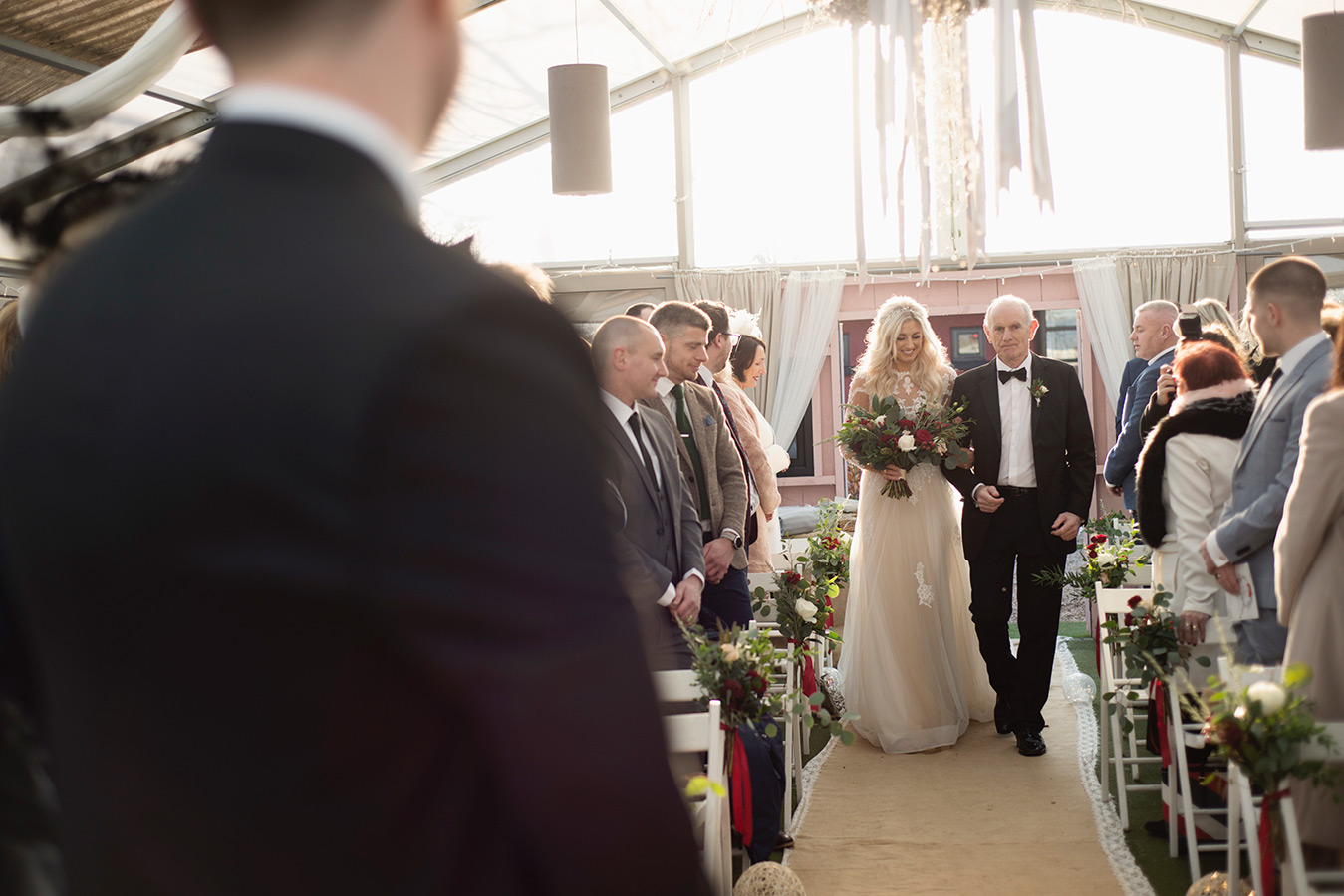 bride walks down the aisle at coolbaun quay wedding ceremony