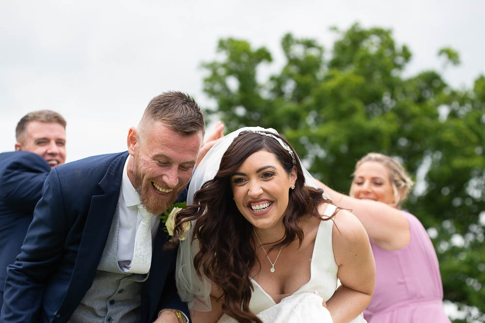 bride and groom laughing at wedding at Rathsallagh House