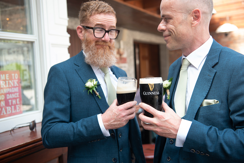 Groomsmen enjoying a pint at wedding at Clonabreany House