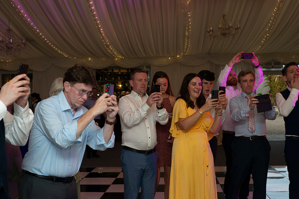 Guests enjoy watching bride and groom first dance at August Wedding at Clonabreany House