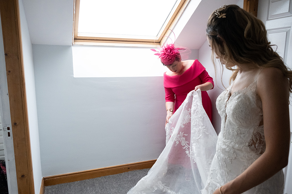 mum helps dress Glasson Lakehouse bride for her wedding