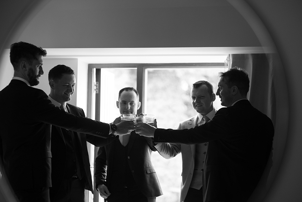 Groomsmen have pint before wedding at Glasson Lakehouse