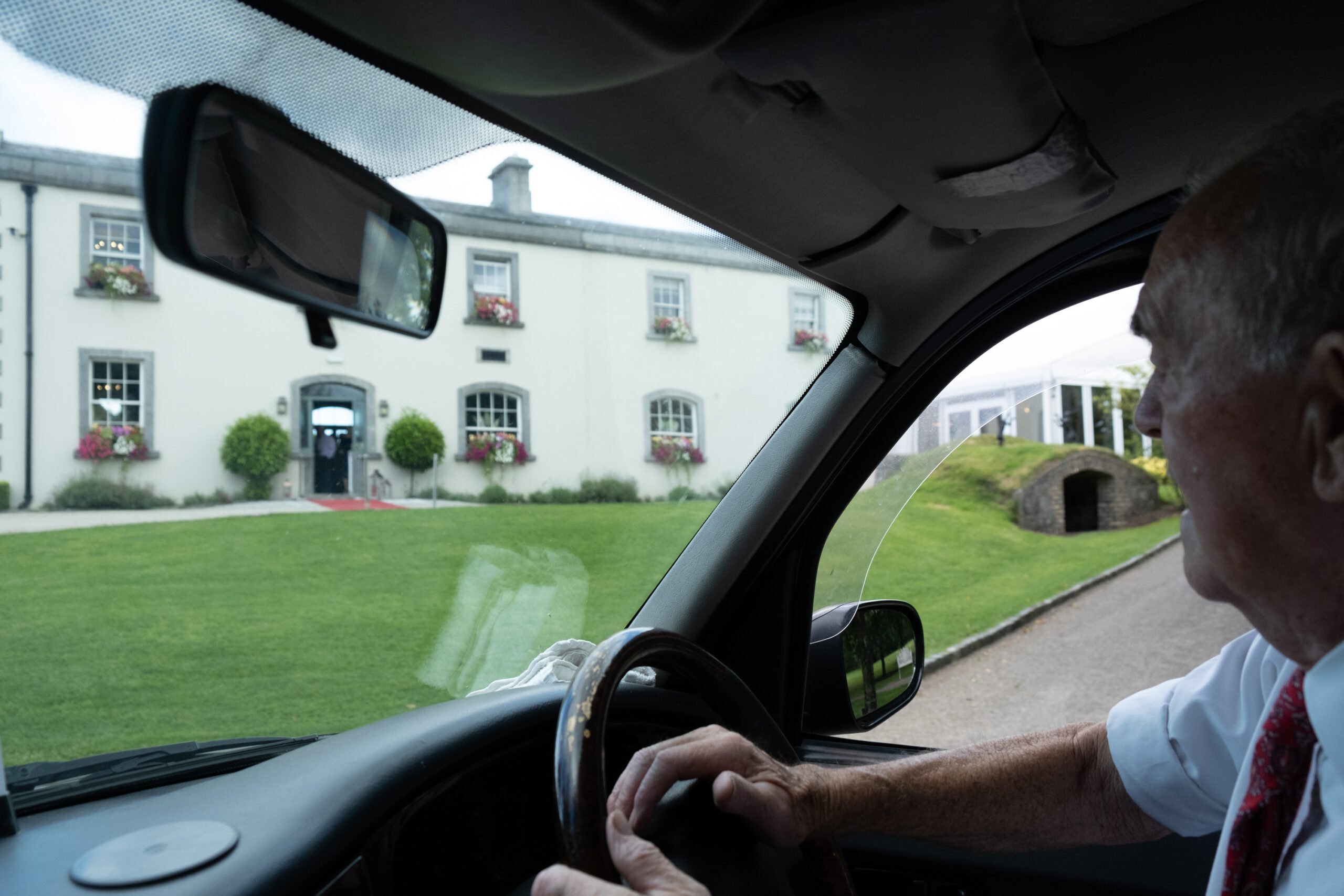 black taxi cab at wedding at Clonabreany House