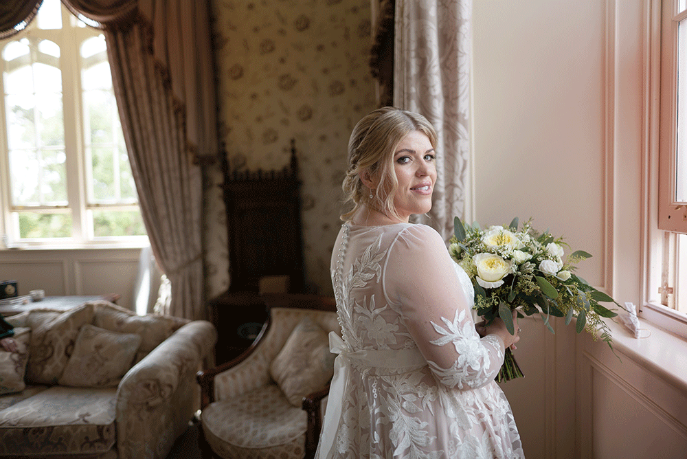 bride in window at wedding at Kilronan Castle