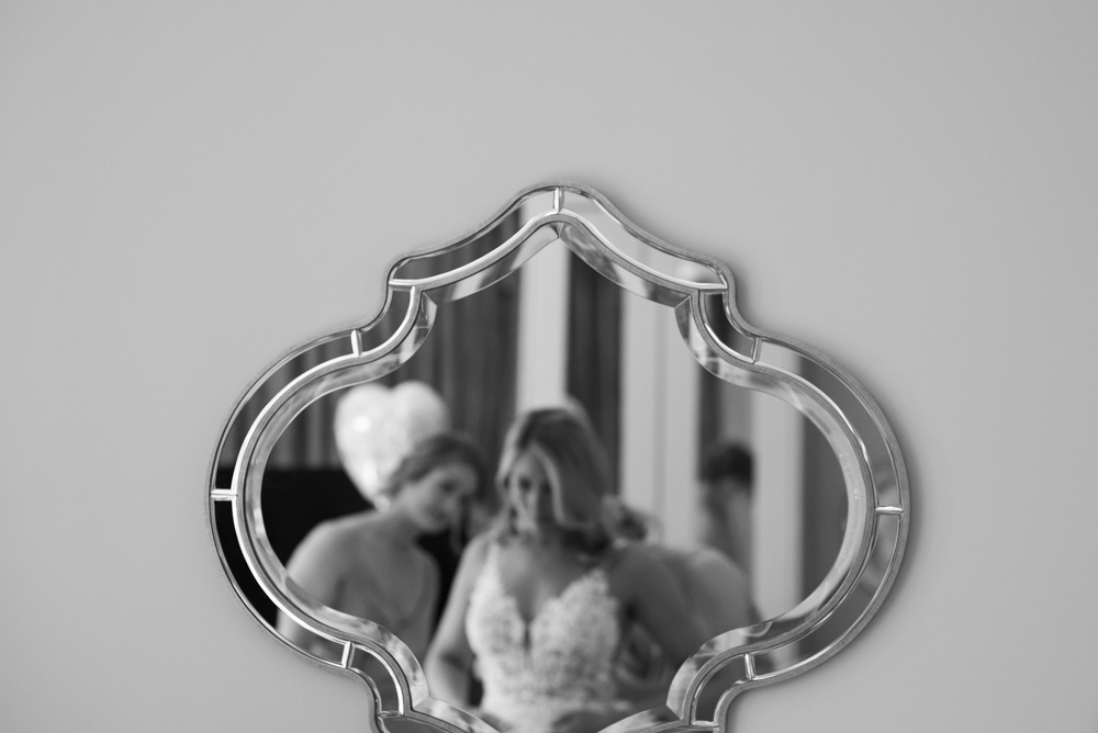 reflection in mirror of bride on her wedding day at Woodlands Hotel Adare