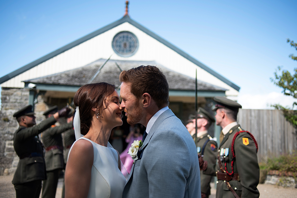 kissing at wedding at Clonabreany House