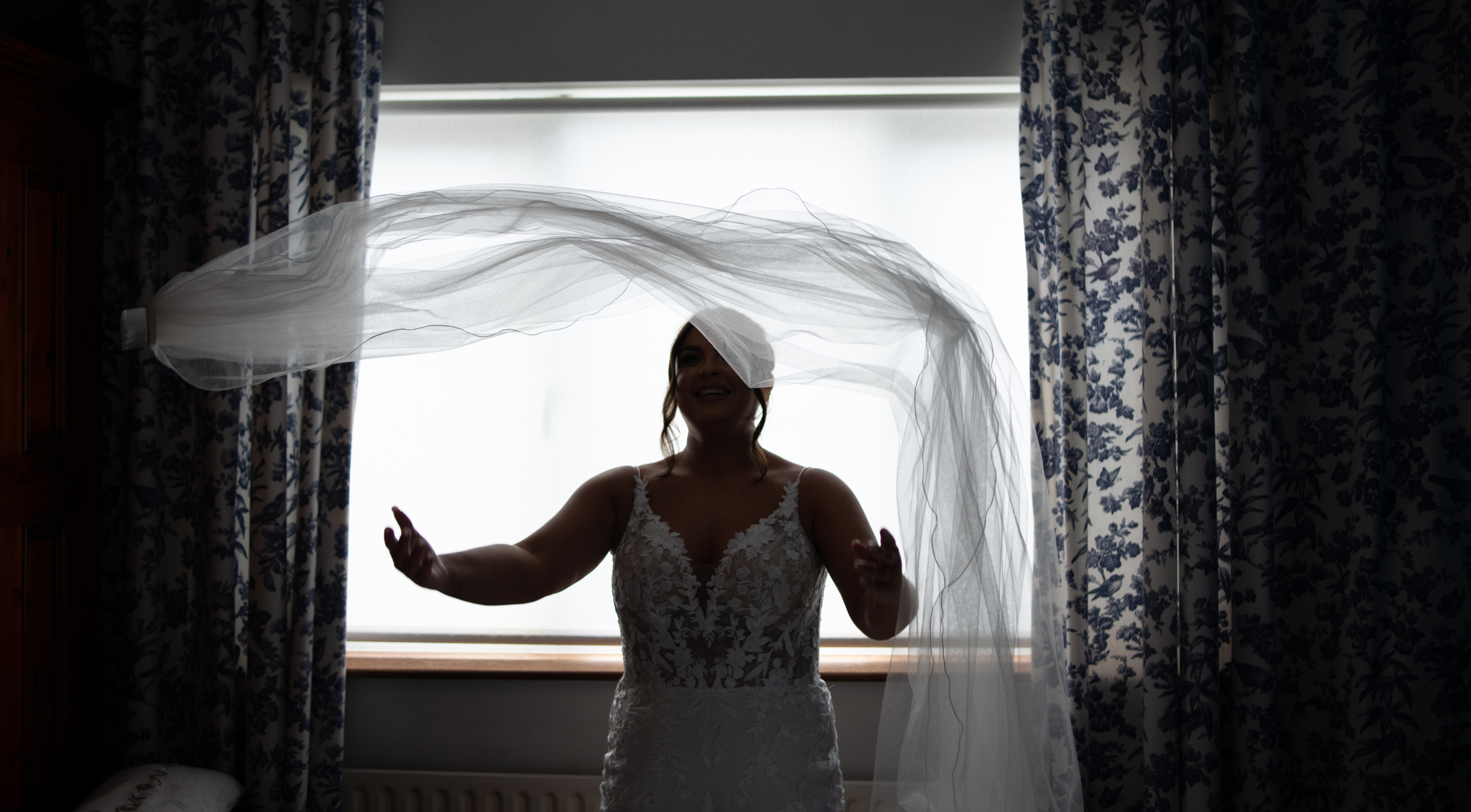 Black and white photo bride with flowing veil