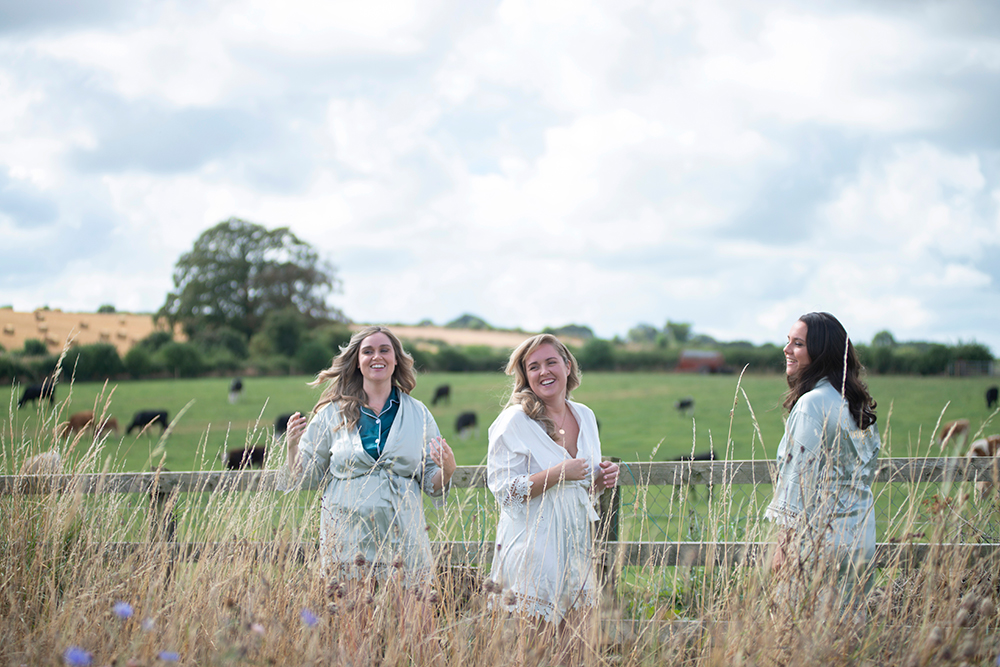 Bride and bridesmaids in field for Autumn Wedding at Darver Castle