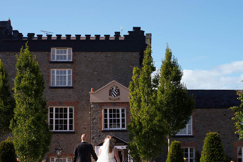 bride and groom in front of castle at Darver Castle Wedding