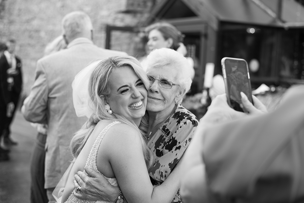 Granny and Bride enjoying a candid moment at wedding at Boyne Hill House