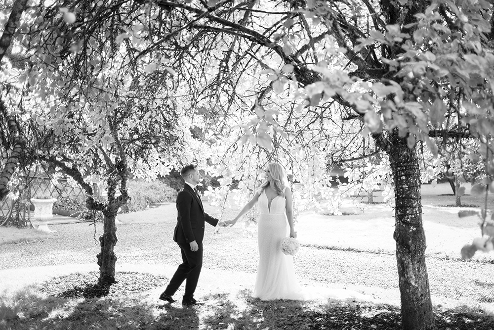 Bride and groom in walled garden at Boyne Hill House