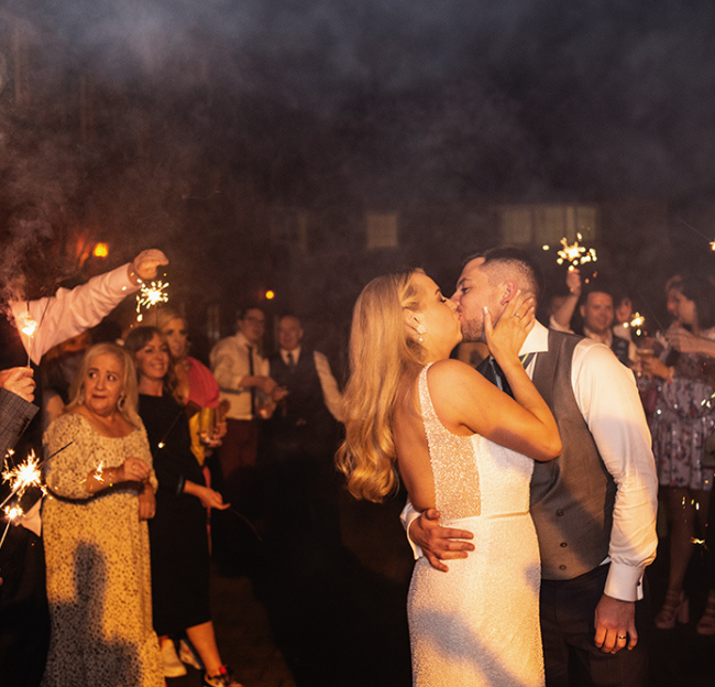 Shauna and Ronan kissing with sparklers