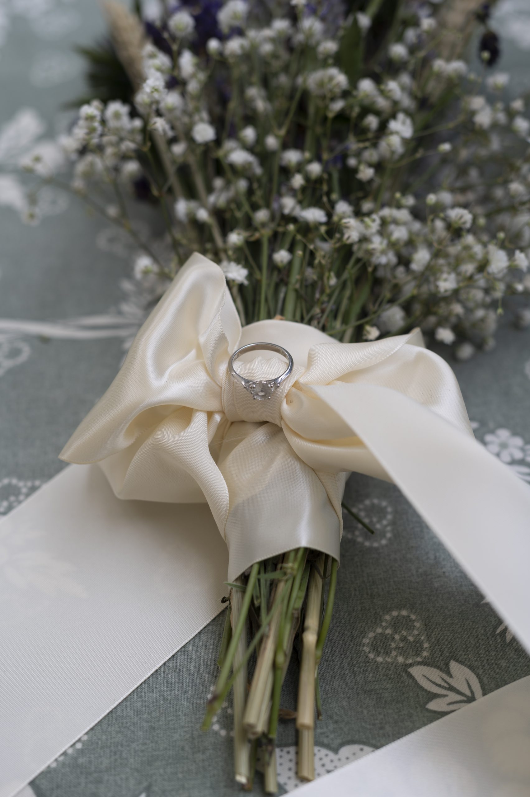close up of ring on top of bouquet