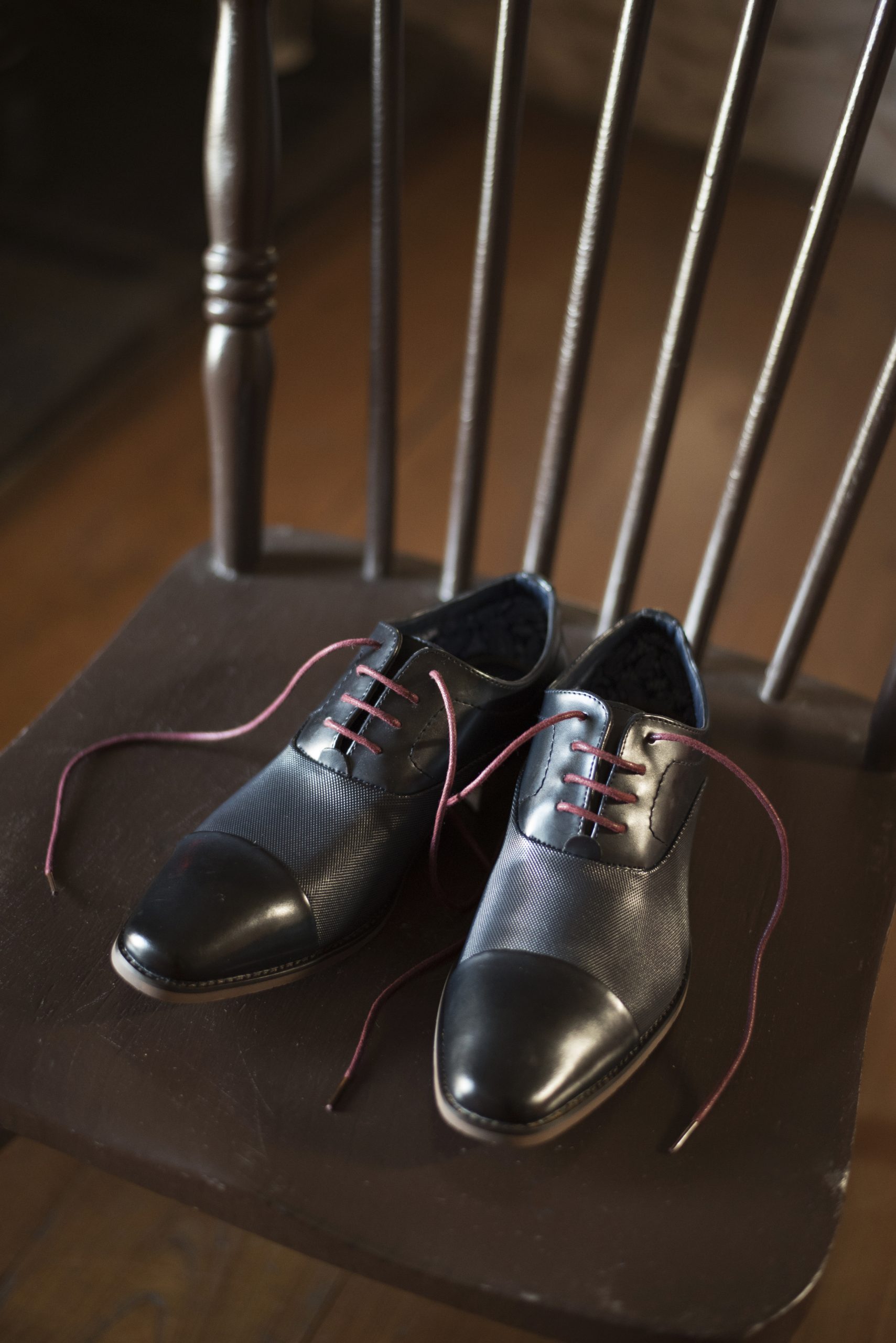 grooms shoes on wooden chair