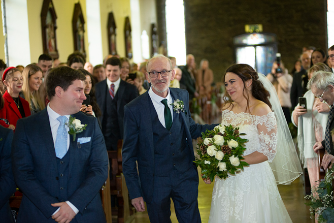 bride going down aisle at wedding at Dunlavin Church Ireland