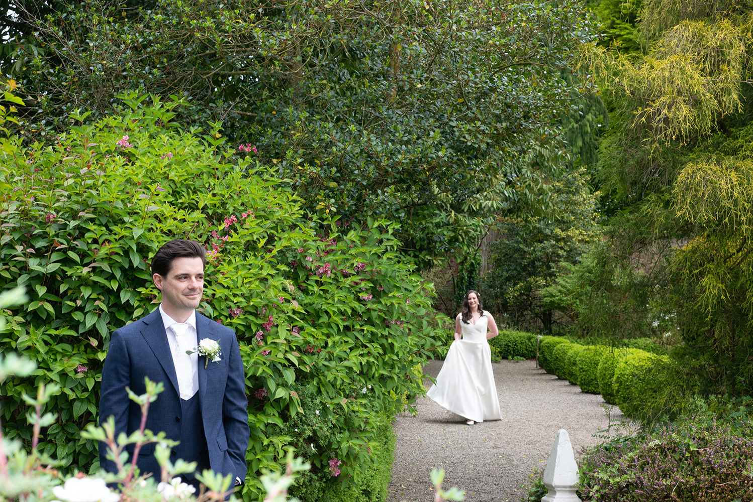 bride doing first look at Rathsallagh House gardens before wedding ceremony