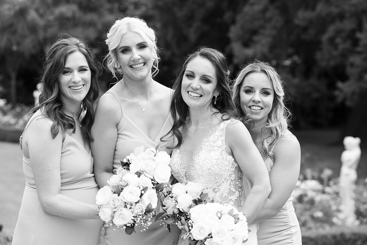 bridesmaids and bride smiling at Tinakilly House wedding