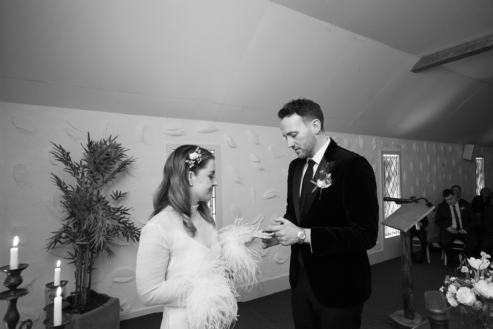 bride and groom exchange rings at Rathsallagh House