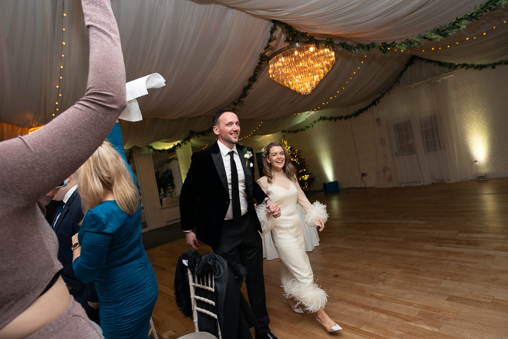 bride and groom enter the room at rathsallagh